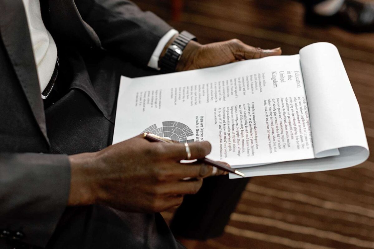 A Nigerian government procurement official reviewing technology vendor proposals and evaluation cri